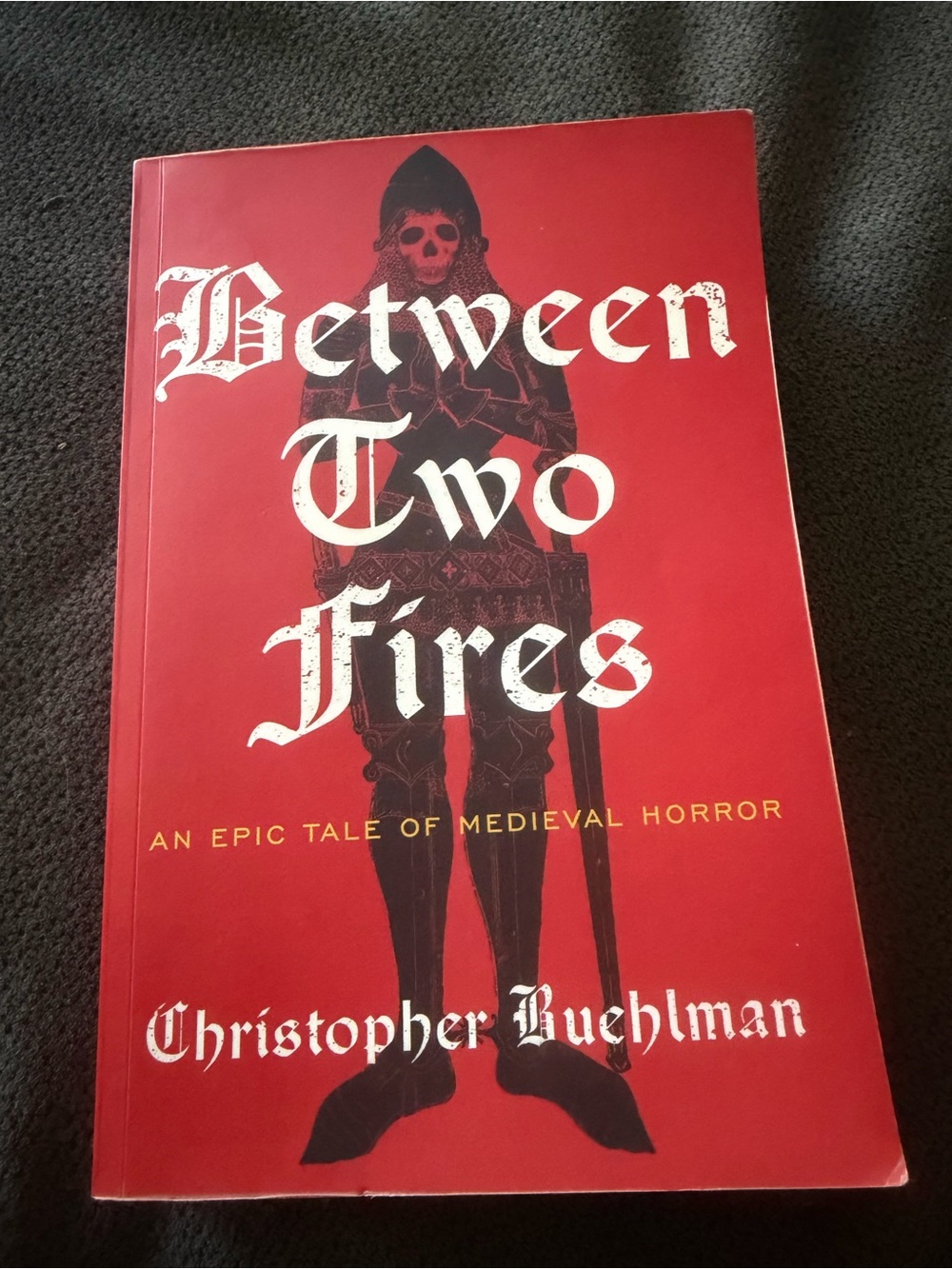 Between Two Fires by Christopher Buehlman - Red Cover